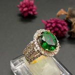 Emerald and zircon ring